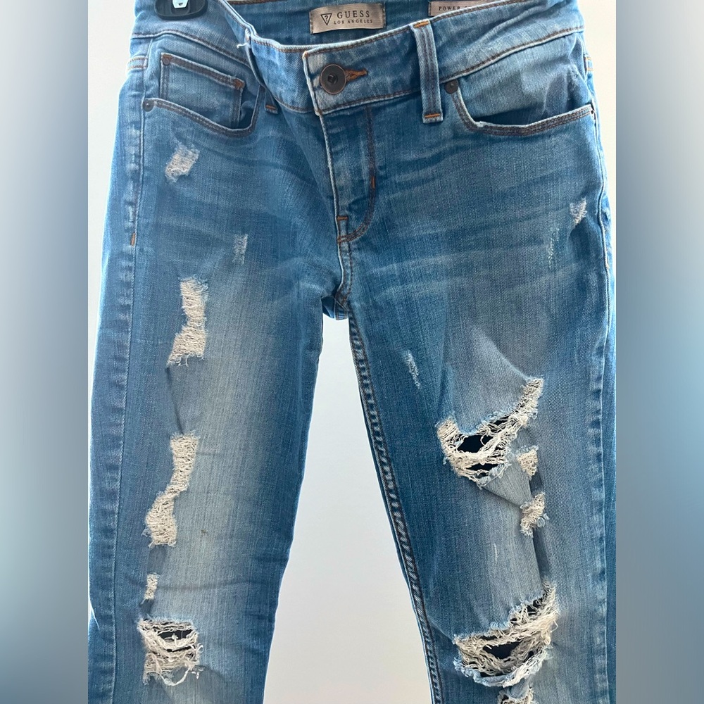 Guess distressed low rise skinny jeans. Size 27